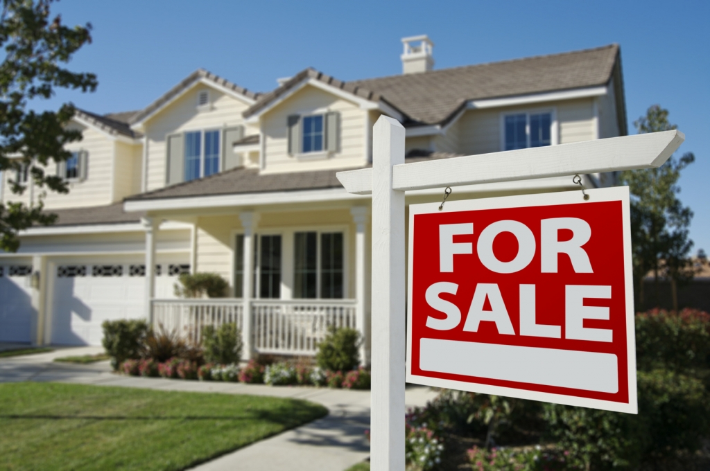 Home For Sale Sign in Front of New House.